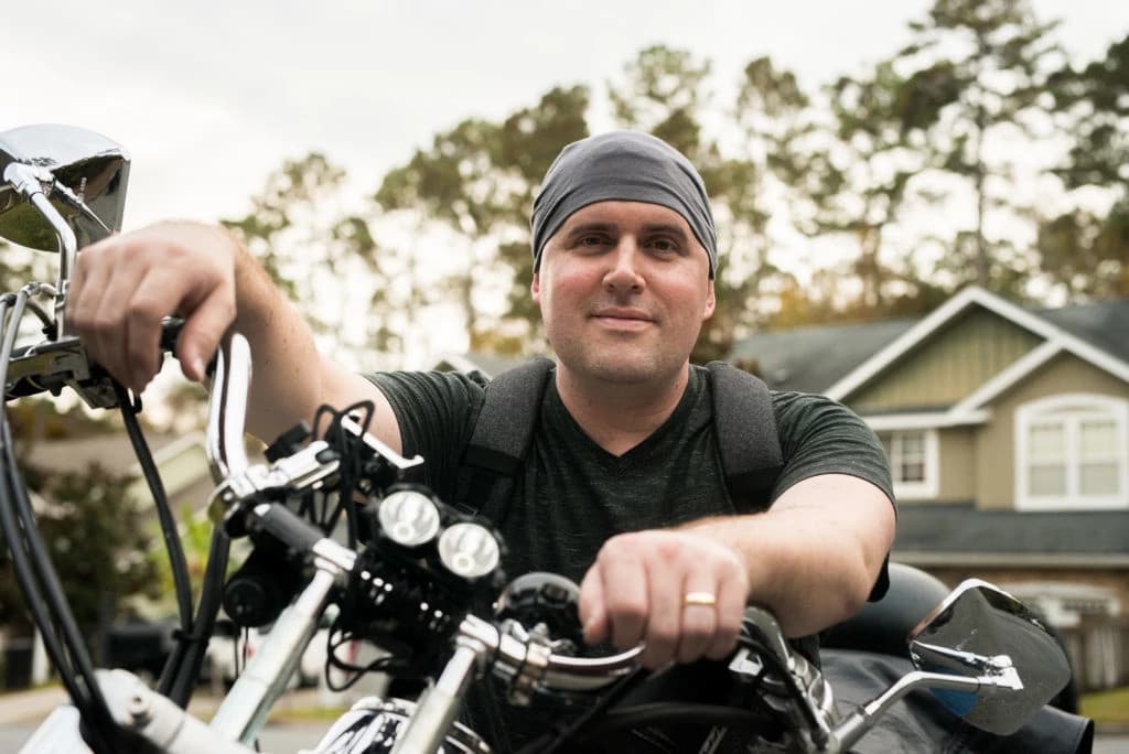 Group of diverse professionals collaborating in a modern office with whiteboards and sticky notes