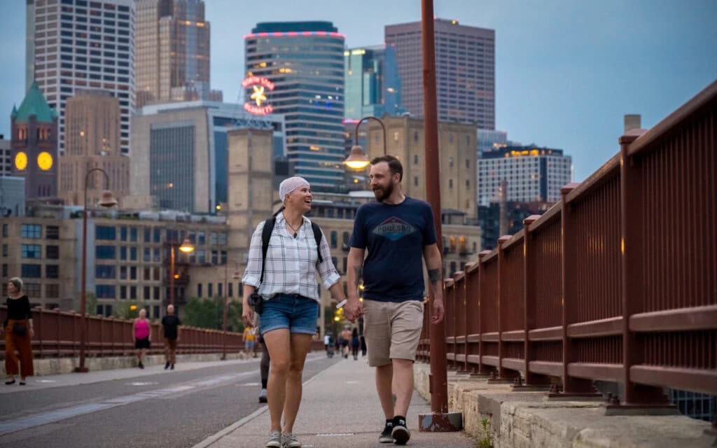 Portrait of a confident young man with crossed arms wearing a black shirt