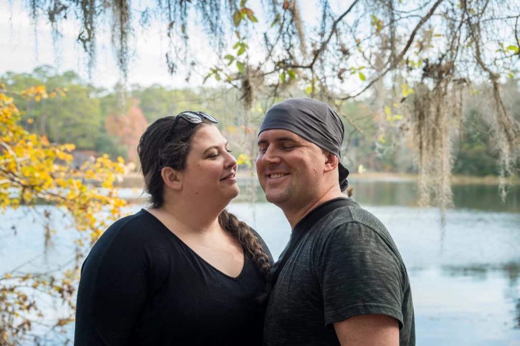 Group of healthcare professionals discussing medical strategy around a laptop in a modern office