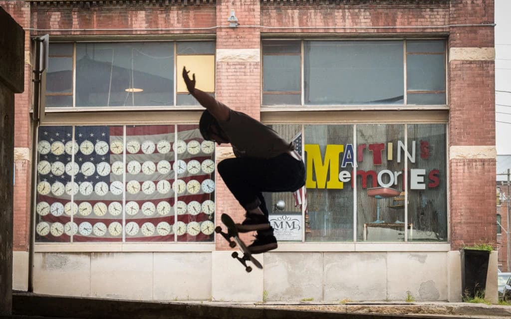 Medical professional wearing glasses analyzing brain scans on computer screens in a modern healthcare setting