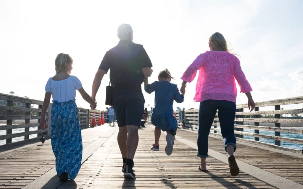 Portrait of Mike smiling in a professional setting with modern office background