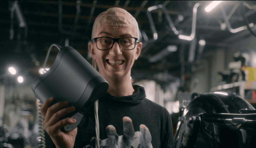 Professional woman in business attire smiling confidently with arms crossed in modern office environment