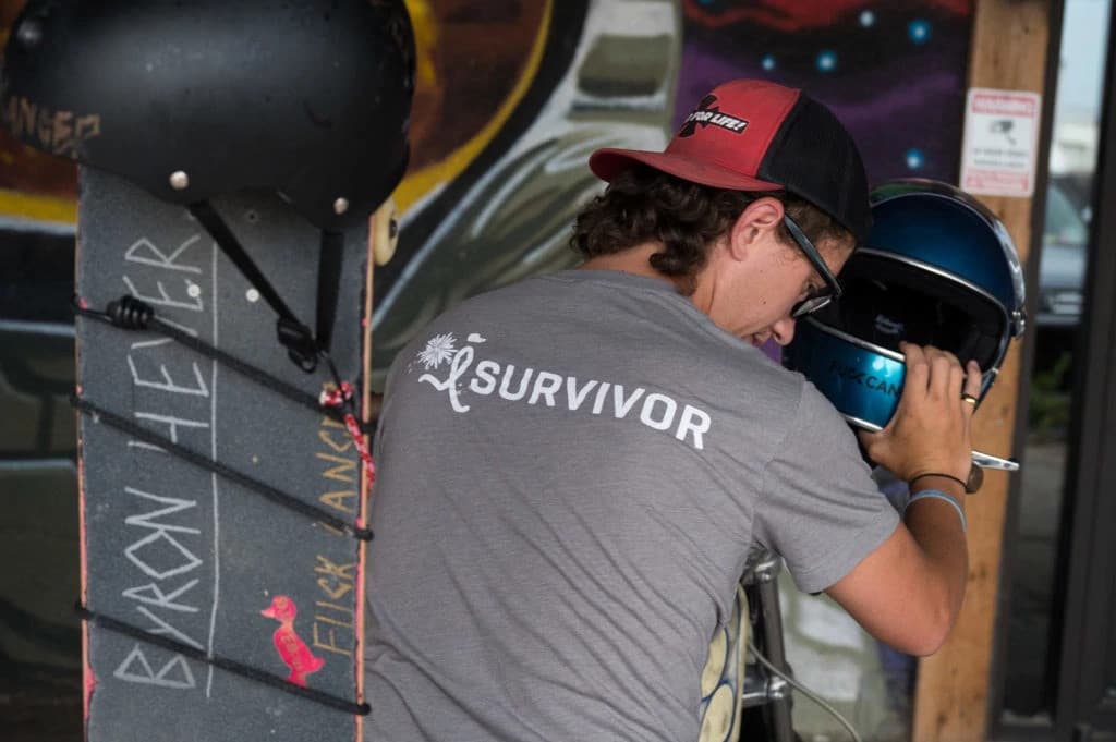 Novocure scientist analyzing cancer treatment data on a digital tablet in a modern laboratory